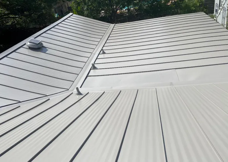 Solar attic fan installed on a metal roof for Roof Ventilation in Warsaw